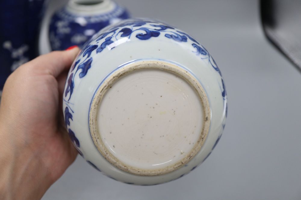 A Chinese blue and white prunus vase, height 36.5cm, jar and a kangxi blue and white jar (lacking cover)